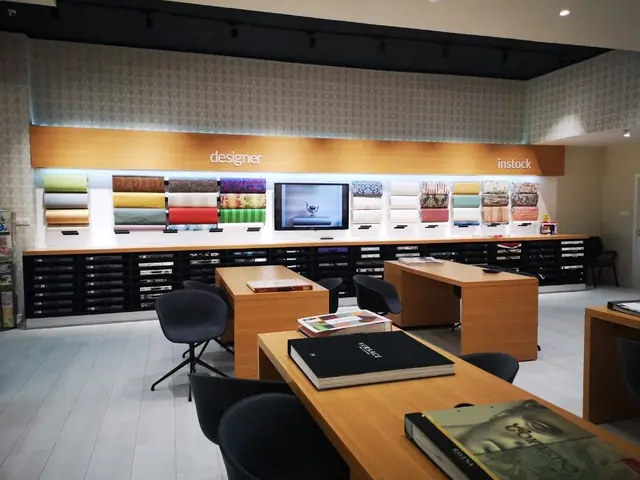 NGC Nafees wallpaper outlet: Wallpaper showroom with timber display walls and sample desks