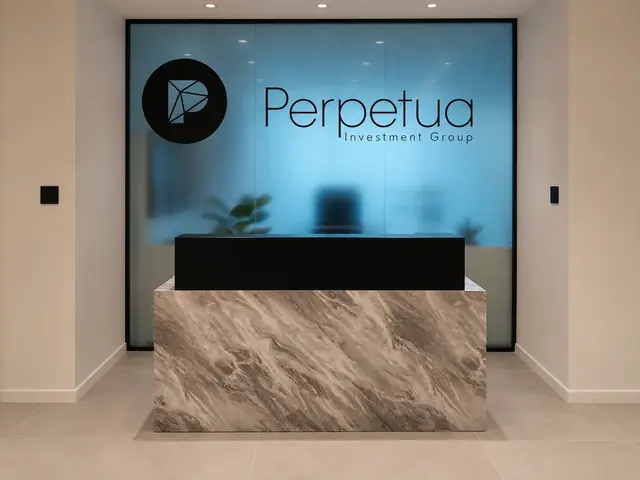 Perpetua Investment Group: Reception desk in front of a frosted glass screen